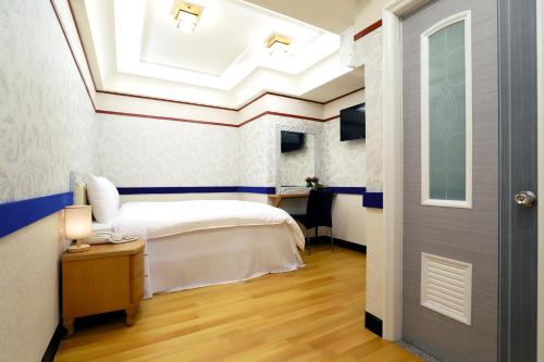 Cama ou camas em um quarto em Phoenix Pavilion Hot Spring Hotel