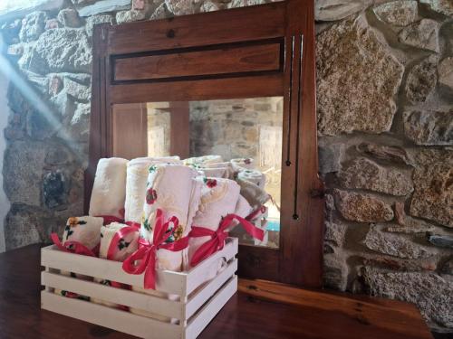 a stack of christmas socks in front of a mirror at Su Furriadroxiu in San Vito