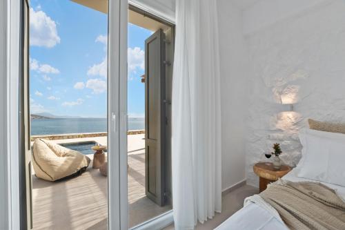 Ένα ή περισσότερα κρεβάτια σε δωμάτιο στο Roos Villas Naxos