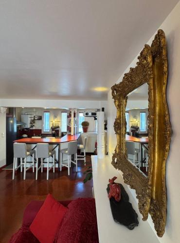 a living room with a mirror on the wall at Red Flat Paris in Paris