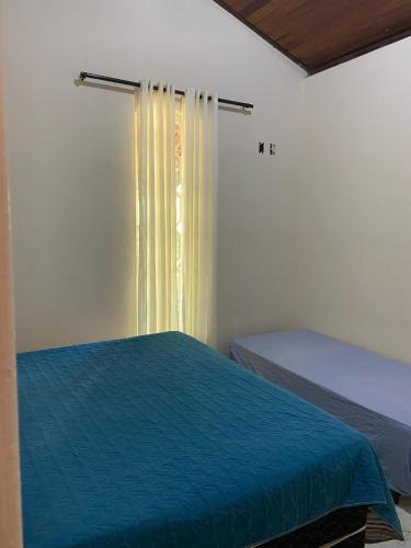 Ένα ή περισσότερα κρεβάτια σε δωμάτιο στο Sitio Marques