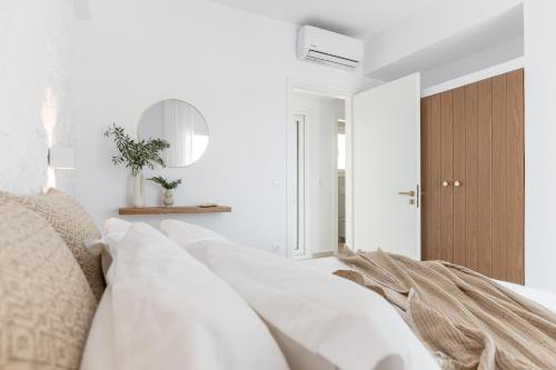 Ένα ή περισσότερα κρεβάτια σε δωμάτιο στο Roos Villas Naxos