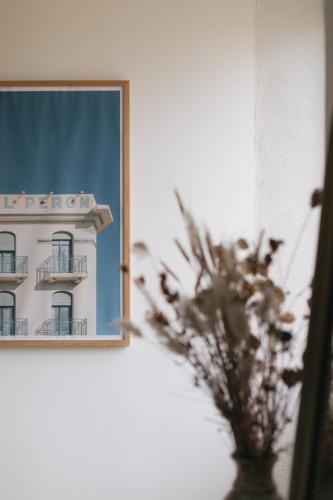 a reflection of a building in a mirror at Gîte Guillaumand in Pompignan