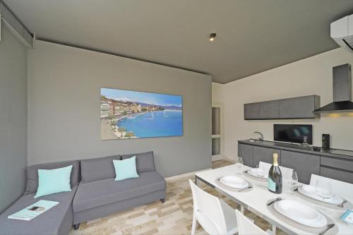 a living room with a couch and a table at Hotel Spiaggia d'Oro - Charme & Boutique - Garda Lake Collection in Salò