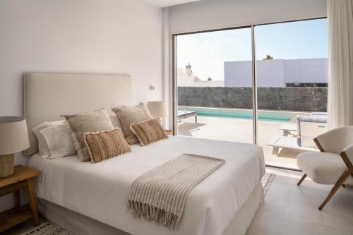 Ένα ή περισσότερα κρεβάτια σε δωμάτιο στο Villas Elements by Alondra