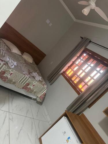 Ένα ή περισσότερα κρεβάτια σε δωμάτιο στο Hotel-Pousada Quartzo Rosa