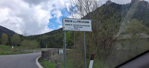 a white sign on the side of a road at Wuthering Heights in Angolo Terme
