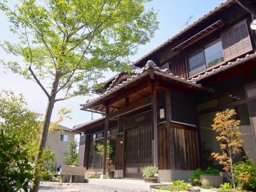 a house with a tree in front of it at Haru, - Vacation STAY 66521v in Hama