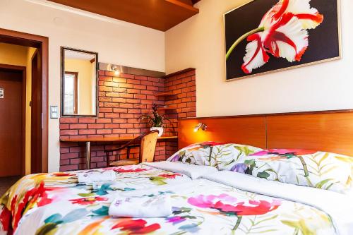 Postel nebo postele na pokoji v ubytování Hotel Áčko