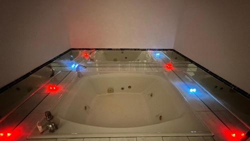 a bath tub with christmas lights on top of it at Chesaning INN & Suites in Chesaning