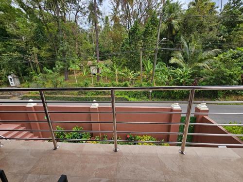a railing on the side of a road at Agape Suites-Room 4- 1st Floor in Soufrière