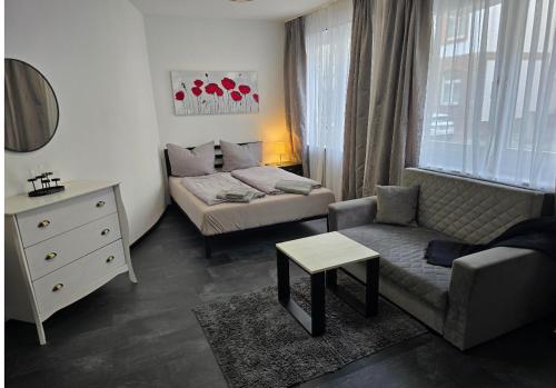 Postel nebo postele na pokoji v ubytování Modernes und gemütliches Studio in Karlsruhes Zentrum - APOLONIAliving