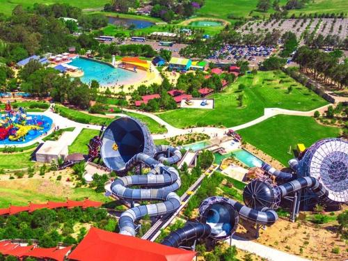 an aerial view of a water park with a roller coaster at Coastal 3 bedroom duplex Everything at your doorstep in Towradgi
