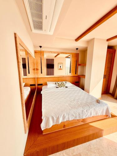 a bedroom with a large bed in a room at The May Five - Adults only in Seferihisar