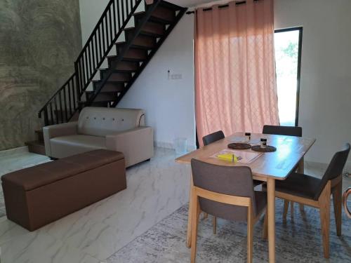 Et opholdsområde på Anggun Homestay