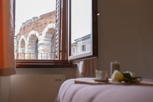 Ein Bett oder Betten in einem Zimmer der Unterkunft Le STELLE SULL'ARENA