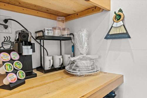 a counter with a coffee maker on a shelf at Green Acres Retreat in Hancock