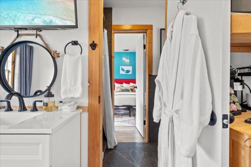 a bathroom with a sink and a mirror at Green Acres Retreat in Hancock