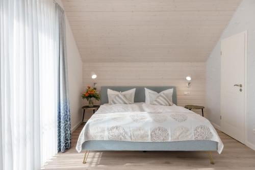 Postel nebo postele na pokoji v ubytování Ferienhaus Neukamp 17C Seehütte