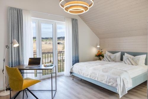 Postel nebo postele na pokoji v ubytování Ferienhaus Neukamp 17D Schilfhütte