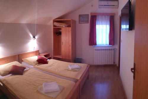 Un pat sau paturi într-o cameră la House Vukovic