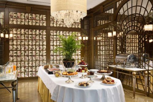 a table with food on it in a room at Hotel Balestri - WTB Hotels in Florence