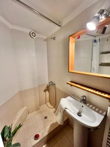 a bathroom with a sink and a shower at Nikiti Azzurro villa in Nikiti