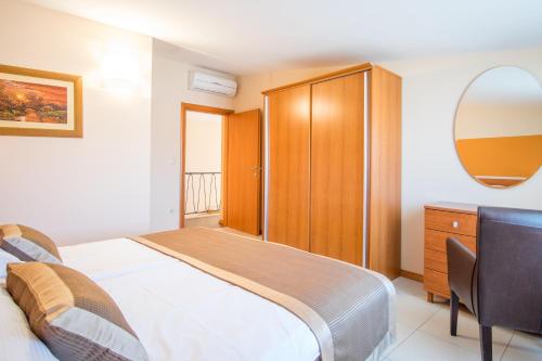 Tempat tidur dalam kamar di Villa Palma