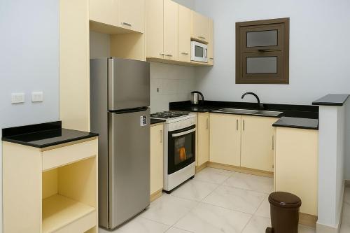 Nhà bếp/bếp nhỏ tại Cozy Seaside Getaway Youll Love Porto Said