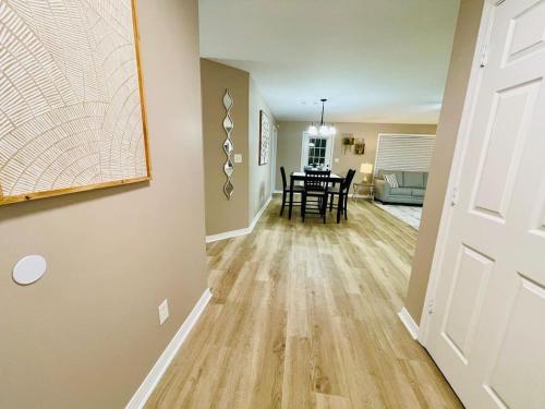 a hallway with a dining room and a dining table at Eastgate 10A beautiful townhouse in Hammond