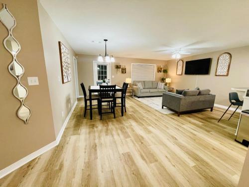 a living room with a table and a couch at Eastgate 10A beautiful townhouse in Hammond