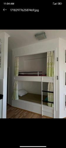a white room with a bed in a room at Apartment Olive in Utjeha