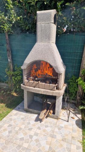 a stone oven with a fire inside of it at Casa Alba Paestum in Paestum