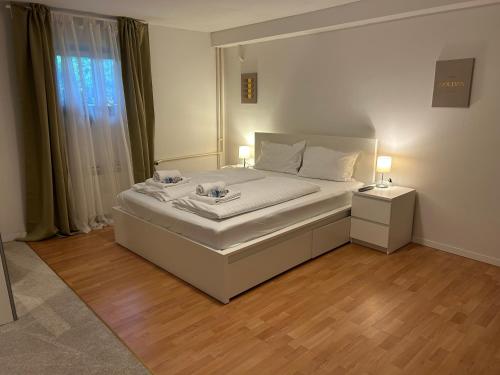 a bedroom with a bed with two lamps on it at Near airport Zagreb, Wi-Fi, Netflix, Self check in in Velika Gorica