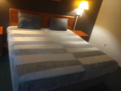 Postel nebo postele na pokoji v ubytování 2 Double Beds Hotel Studio 126