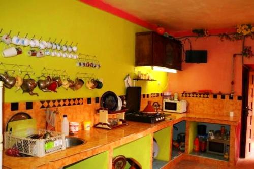a kitchen with a sink and a counter top at DAR Moha dades in Aït Ougliff