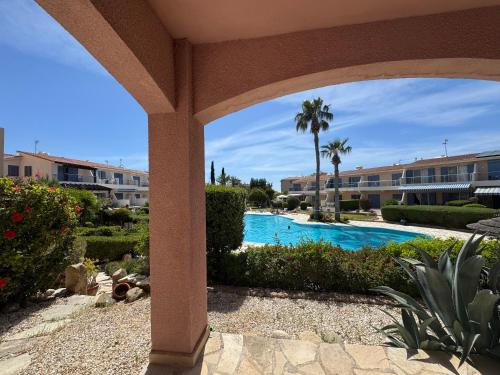 a view of a swimming pool at a resort at Beautiful 1-bd Ap near the beach historic places in Paphos