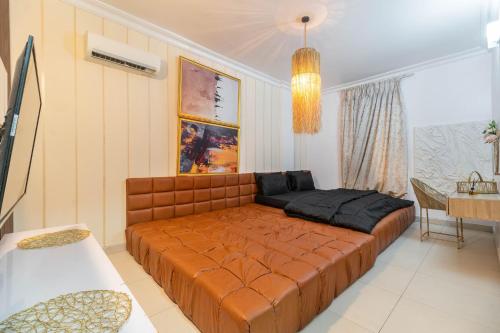 a bedroom with a large bed in a room at Tastefully furnished two bedrooms lekki lagos in Lekki