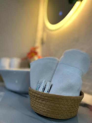 a basket of towels on a table on an airplane at Residencia Esmeralda in Agua Buena