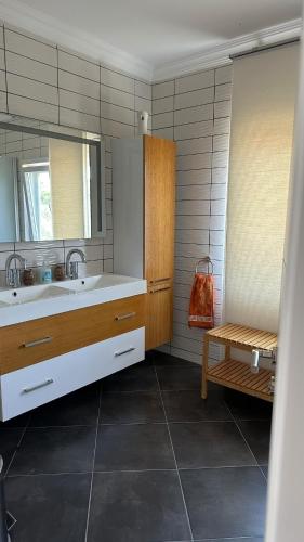 a bathroom with a sink and a mirror at Relaxing Stay by the Beach in Ayvalık