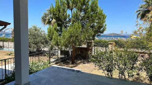a villa with a view of the ocean at Relaxing Stay by the Beach in Ayvalık