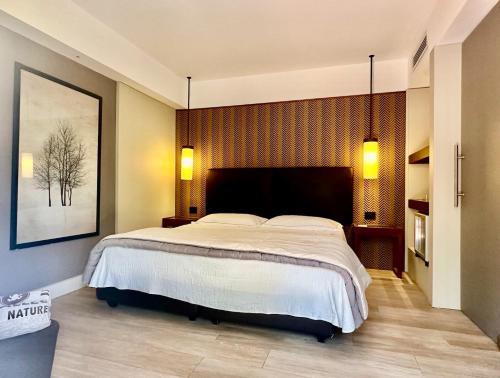 a bedroom with a large bed in a room at Vallegrande Nature Resort by Geocharme in Cefalù