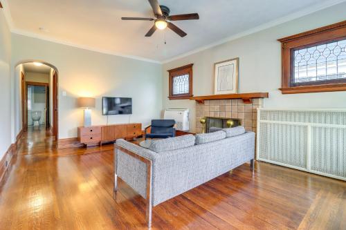 a living room with a couch and a fireplace at Walkable Apt 4 Mi to Downtown Toledo! in Toledo