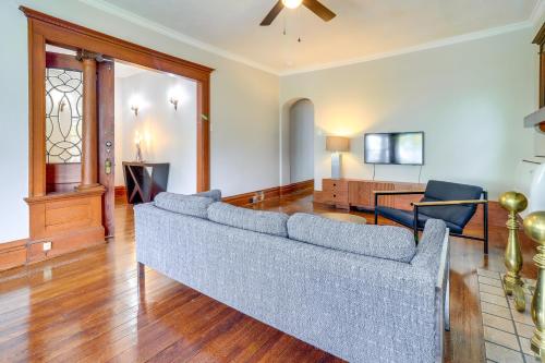 a living room with a couch and a tv at Walkable Apt 4 Mi to Downtown Toledo! in Toledo
