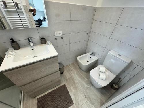a bathroom with a sink and a toilet at Splendida Casa vista mare per 4 persone di fronte alle spiagge di Bussana in Bussana Nuova