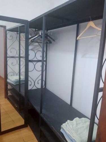 a black bunk bed in a room at Loulou in Lomé