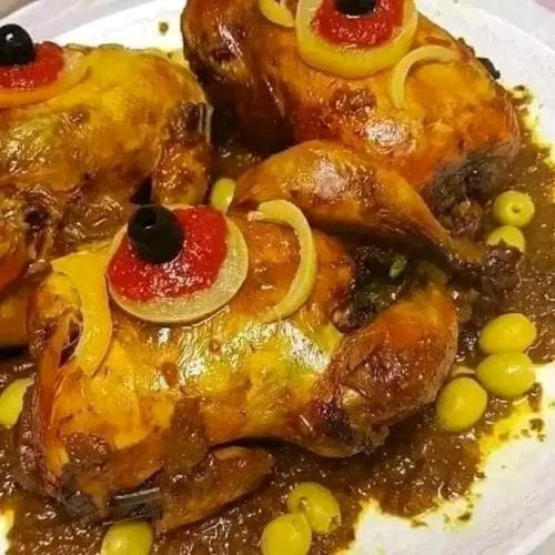 a plate of food with chicken and vegetables on it at DAR Moha dades in Aït Ougliff