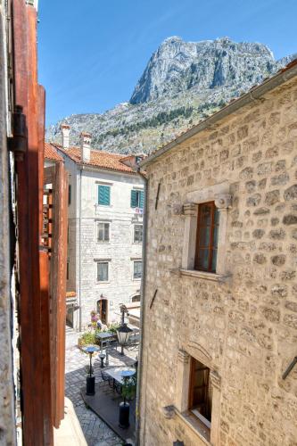 a view from a building with a mountain in the background at Hotel Rendez Vous in Kotor