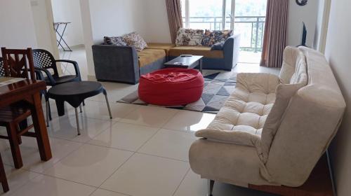 a living room with a couch and a table at Urban living at Fairway in Battaramulla