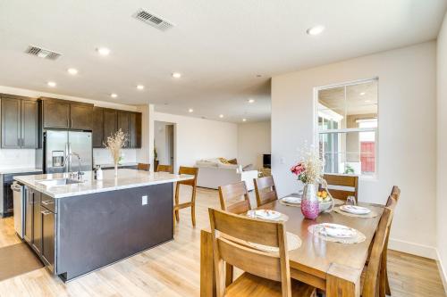 a kitchen and dining room with a table and chairs at Pool Paradise Spacious Tracy Home with Yard! in Tracy